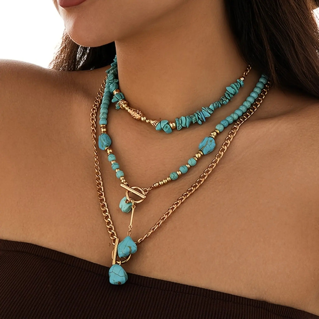 A set of three bohemian turquoise beaded stacked necklaces for women, perfect as accessories for holidays, birthdays, dates, parties, vacations, shopping, and daily commutes